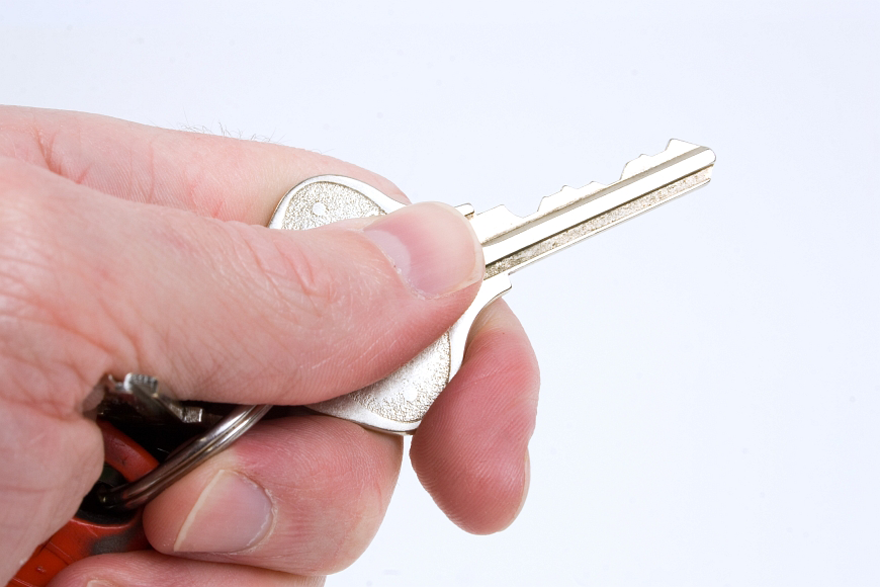 Image of Man Holding Key